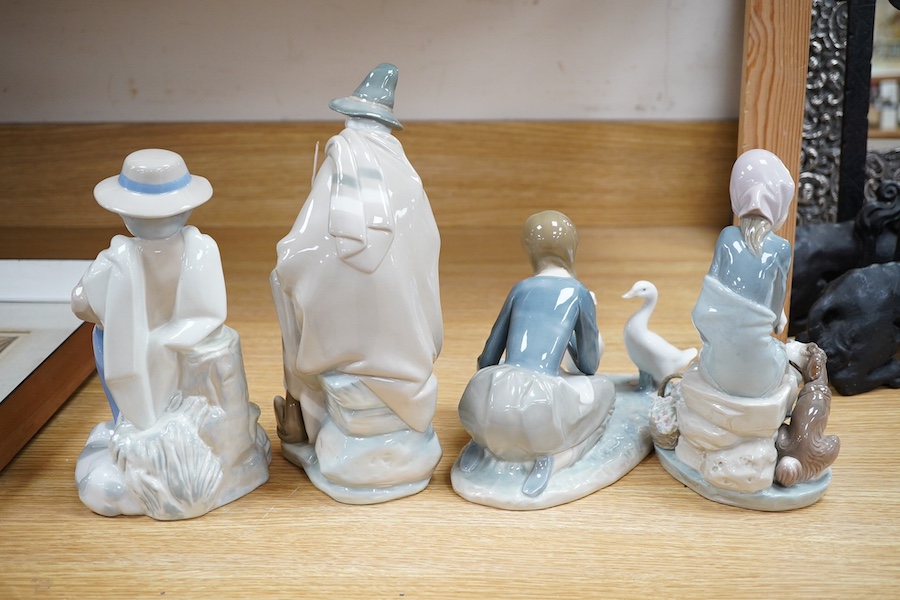 Four Lladro figures; elderly man with a dog, a girl with two ducks, a shepherdess and a boy shepherd, tallest 27cm. Condition - good